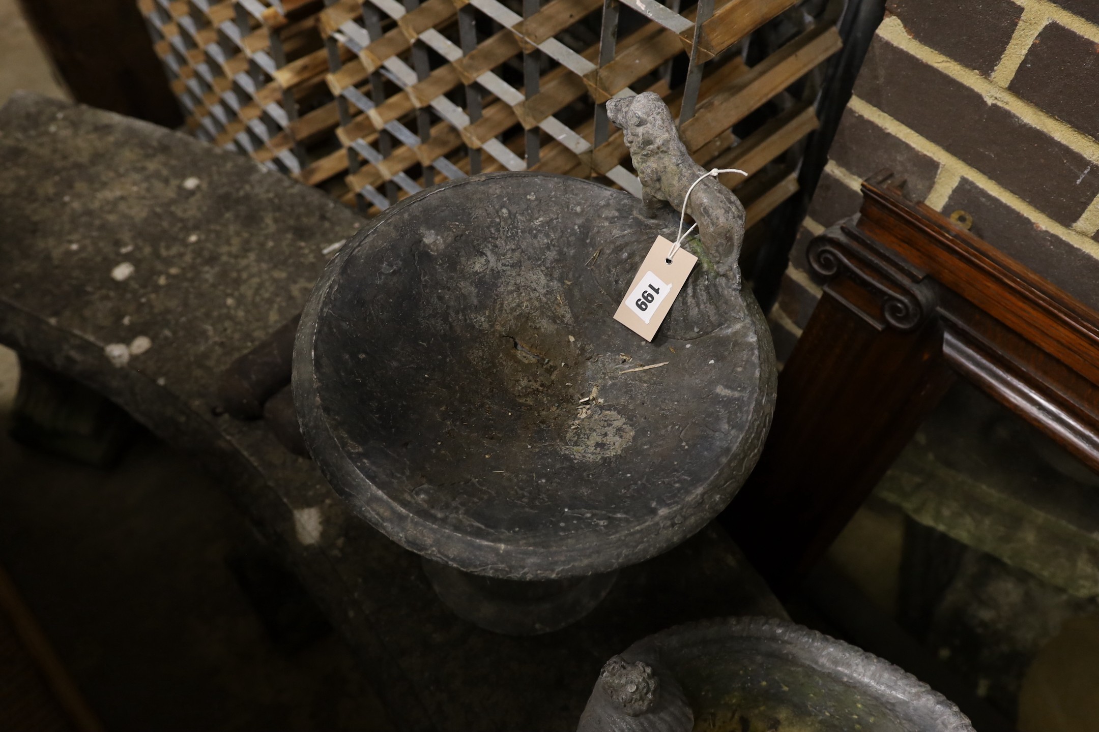 A lead garden bird bath with lion surmount, height 44cm together with a lead planter